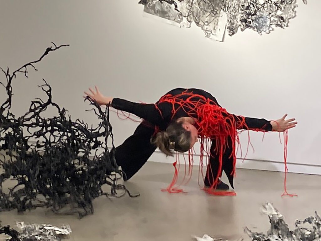 Paula Gil Higa performs in Debra Weisberg’s installation